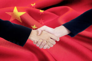 Handshake with chinese flag background